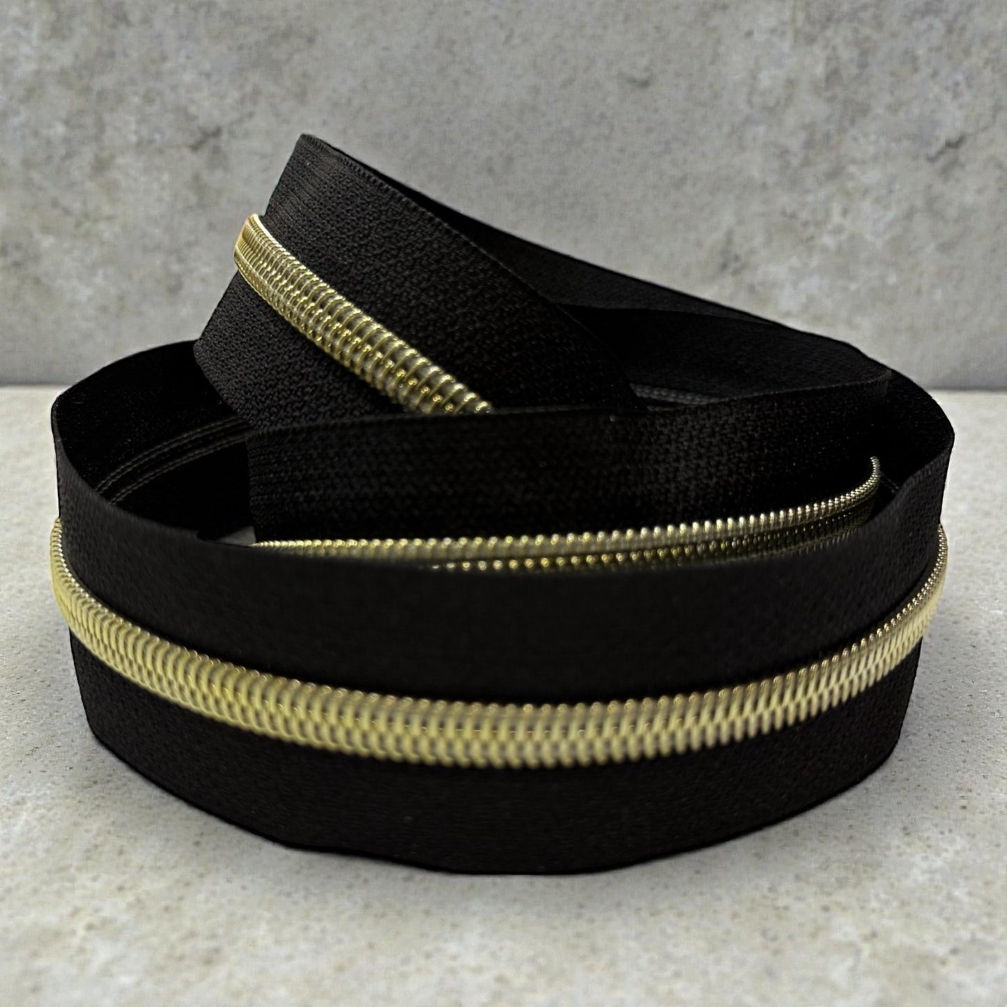 Classic Black #5 Nylon Zipper Tape with Gold Coil (Sold by the Yard)
