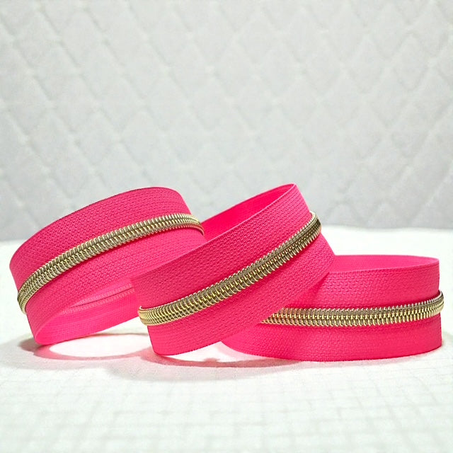 Hot Pink Nylon Zipper Tape with Gold Coil (Sold By the Yard)