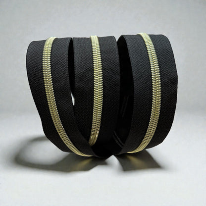Classic Black #5 Nylon Zipper Tape with Gold Coil (Sold by the Yard)