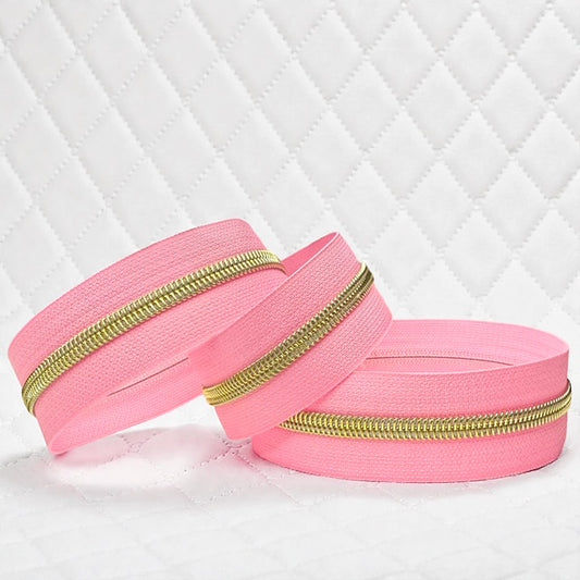 Pink Nylon Zipper Tape with Gold Coil (Sold By the Yard)