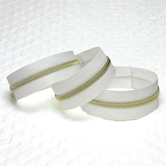 White #5 Nylon Zipper Tape with Gold Coil (Sold by the Yard)